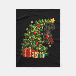 Black cat hanging from christmas tree festive pet fleece blanket