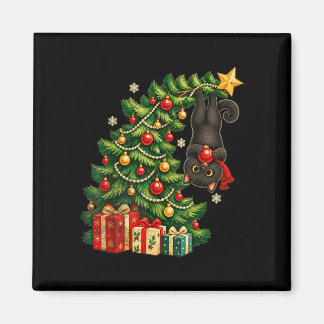 Black cat hanging from christmas tree festive pet magnet