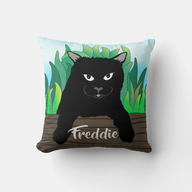 Black cat on fence with green grass, solid back cushion (Front)