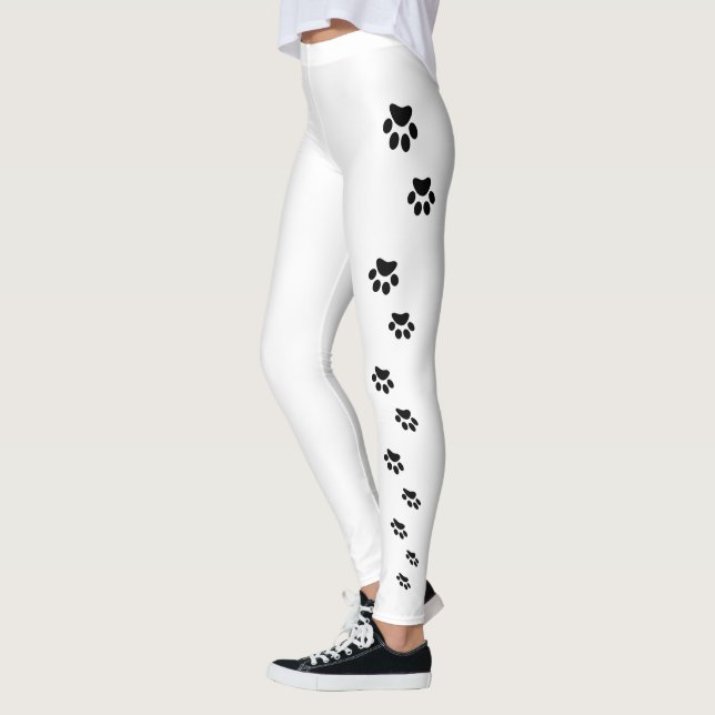 Black cat paw prints on white leggings (Left)