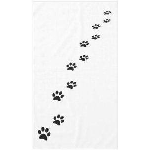 Black cat paw prints on white tablecloth