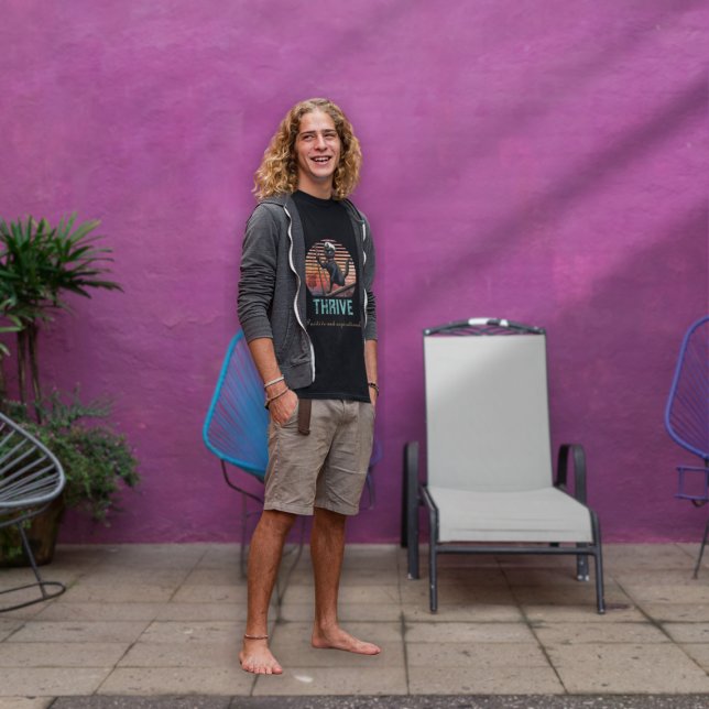 Black Cat Sunset: A Voyage to THRIVE T-Shirt (A man wears a Black Cat Sunset: A Voyage to THRIVE T-Shirt.)