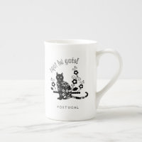 Black cat with flowers and Portuguese expression