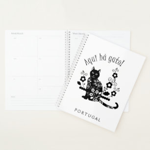 Black cat with flowers and Portuguese expression Planner
