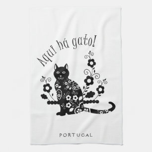 Black cat with flowers and Portuguese expression Tea Towel
