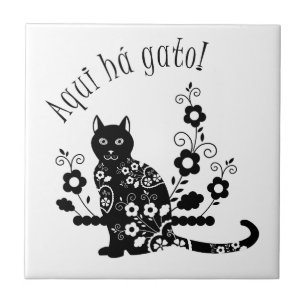 Black cat with flowers and Portuguese expression Tile