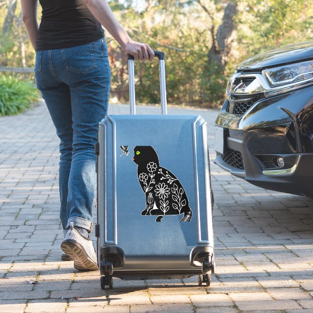 Black cat with green eyes (Suitcase Insitu)