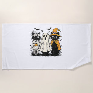Black Cats in Halloween Costumes – Ghost, Witch, a Beach Towel