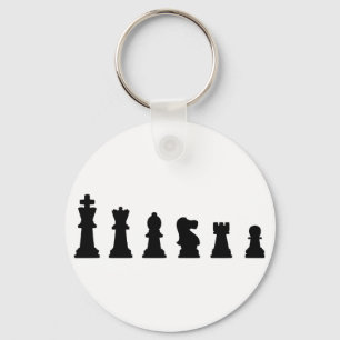 Black chess pieces on white key ring