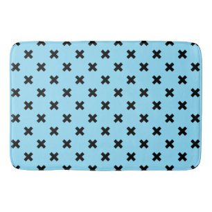 Black cross stitches on baby blue bath mat