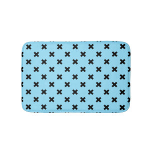 Black cross stitches on baby blue bath mat