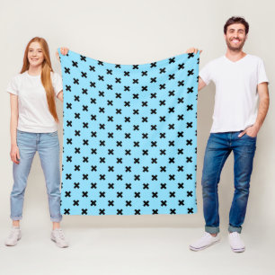 Black cross stitches on baby blue fleece blanket