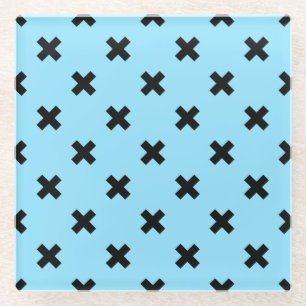 Black cross stitches on baby blue glass coaster
