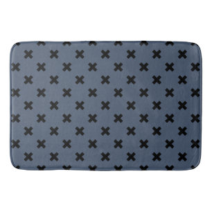 Black cross stitches on blue-grey bath mat