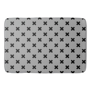Black cross stitches on grey bath mat