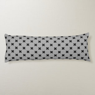 Black cross stitches on grey body cushion