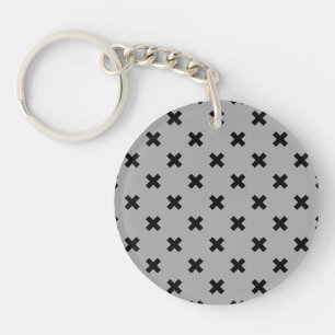 Black cross stitches on grey key ring