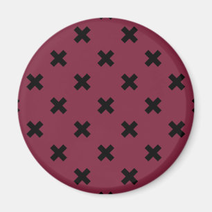 Black cross stitches on mulberry magnet