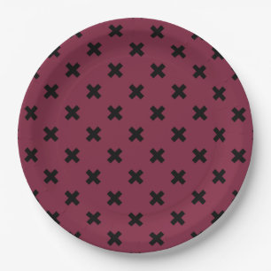 Black cross stitches on mulberry paper plate