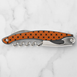 Black cross stitches on orange corkscrew