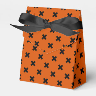 Black cross stitches on orange favour box