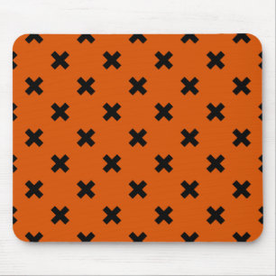 Black cross stitches on orange mouse pad