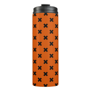 Black cross stitches on orange thermal tumbler