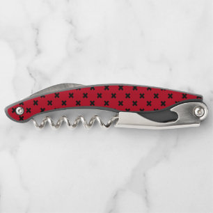 Black cross stitches on red corkscrew