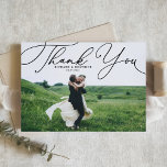 Black Elegant Beatrice Script Photo Wedding Thank You Card<br><div class="desc">Send thanks to family and friends with this customisable wedding thank you card. It features an elegant white script. Personalise this elegant wedding thank you card by adding your own details. This script thank you card will also be perfect for graduations,  birthdays,  first communions,  and so much more.</div>