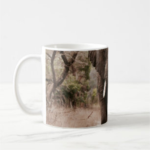 BLACK ELEPHANT WALKING ON BROWN SAND COFFEE MUG
