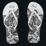 Black Floral Lace and White Glitter Flip Flops<br><div class="desc">Beautiful looking Flip Flop Shoes with faux black floral lace on a faux white glitter background ready for you to personalise with your name or bridal party titles. ⭐This Product is 100% Customisable. *****Click on CUSTOMIZE BUTTON to add, delete, move, resize, changed around, rotate, etc... any of the graphics or...</div>