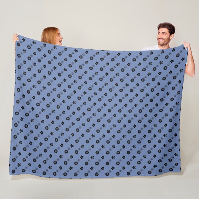 Black floral print on blue fleece blanket (In Situ)
