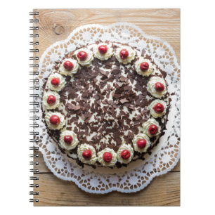 Black Forest cake on rustic wood Spiral Notebook