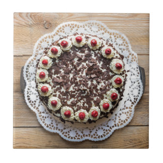 Black Forest cake on rustic wood Tile