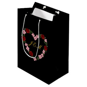 Black gift bag with a pink and red heart