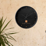 Black gold elegant monogram name personalised<br><div class="desc">Luxury monogrammed round wall clock with a black leather look background and a faux gold copper metallic brushed square with elegant script signature name and monogram initials. Easy to personalise with your business or personal initials and name. Could be an elegant personalised gift for business or any other occasion, personal...</div>