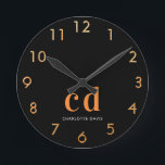 Black gold monogram initials name round clock<br><div class="desc">Personalize and add your monogram letters,  initials and name.  A classic chic black background color.  White and golden colored letters. Golden clock numbers.</div>