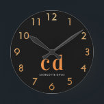 Black gold monogram initials name round clock<br><div class="desc">Personalize and add your monogram letters,  initials and name.  A classic chic black background color.  White and golden colored letters. Golden clock numbers.</div>