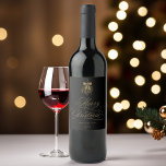 Black & Gold Romantic Calligraphy Merry Christmas<br><div class="desc">This Christmas wine label features elegant and romantic swirly calligraphy lettering,  accented with a winter berry holly bouquet. For more advanced customisation of this design,  please click the BLUE DESIGN TOOL BUTTON. Matching items are also available.</div>