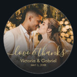 Black Gold Script Love and Thanks Photo Wedding Classic Round Sticker<br><div class="desc">Modern Pretty Black and Gold Calligraphy Script Thank You | Couple Photo Wedding sticker/label for yor gift favour. Featuring an elegant handwritten style calligraphy overlay with text „Love and Thanks”.</div>