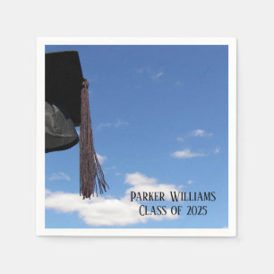 black graduation cap and tassel in sky napkin
