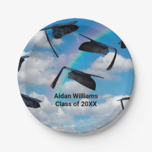 Black graduation caps in sky with rainbow paper plate