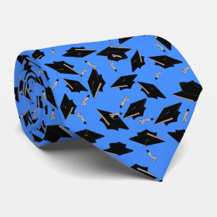 Black Graduation Caps Tossed in the Air on Blue Tie