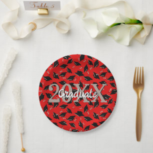 Black Graduation Caps Tossed in the Air on Red Paper Plate