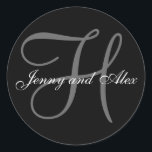 Black Grey Monogram H Bride Groom Names Wedding Classic Round Sticker<br><div class="desc">Elegant wedding sticker with monogram initial of last name and bride and groom names which you can customise with your personal information and wedding colour scheme. A great sticker for wedding favour stickers, cake box labels, wedding treat bag seals, and wedding invitation envelope seals. Design by Elke Clarke ©2008. Use...</div>