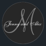 Black Grey Monogram M Bride Groom Names Wedding Classic Round Sticker<br><div class="desc">Elegant wedding sticker with monogram initial of last name and bride and groom names which you can customise with your personal information and wedding colour scheme. A great sticker for wedding favour stickers, cake box labels, wedding treat bag seals, and wedding invitation envelope seals. Design by Elke Clarke ©2008. Use...</div>