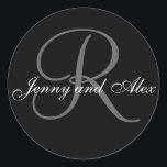 Black Grey Monogram R Bride Groom Names Wedding Classic Round Sticker<br><div class="desc">Elegant wedding sticker with monogram initial of last name and bride and groom names which you can customise with your personal information and wedding colour scheme. A great sticker for wedding favour stickers, cake box labels, wedding treat bag seals, and wedding invitation envelope seals. Design by Elke Clarke ©2008. Use...</div>