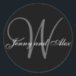 Black Grey Monogram W Bride Groom Names Wedding Classic Round Sticker<br><div class="desc">Elegant wedding sticker with monogram initial of last name and bride and groom names which you can customise with your personal information and wedding colour scheme. A great sticker for wedding favour stickers, cake box labels, wedding treat bag seals, and wedding invitation envelope seals. Design by Elke Clarke ©2008. Use...</div>
