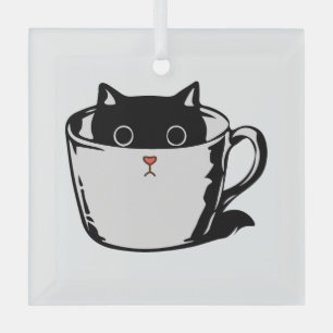 Black kitten with red nose hiding in a cup glass tree decoration
