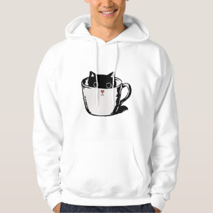 Black kitten with red nose hiding in a cup hoodie